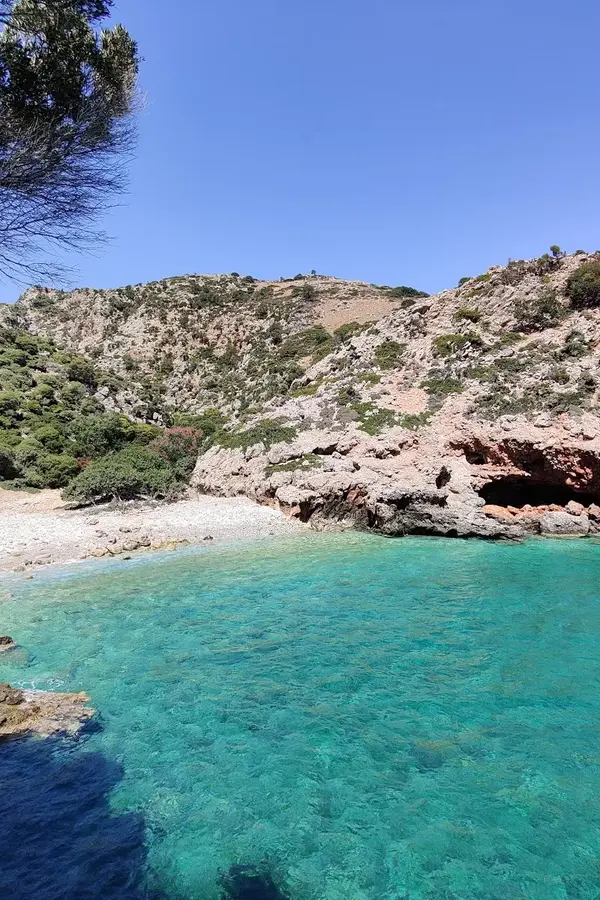 The stretch of fine white sand and crystal clear Aegean waters at Ramyas beach, Crete.
